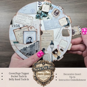 May include: A circular paper craft wheel featuring a collage of vintage French documents, black and white portraits, street scenes, and ephemera. The interactive design includes various tabs and cutouts with printed text like Consigne Bagages.