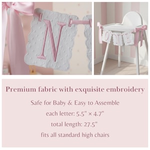 May include: A pink and white banner with the letter "N" embroidered on it, and a high chair decorated with a "ONE" banner. The banner is made of premium fabric with exquisite embroidery. Each letter is 5.5" x 4.7", and the total length is 27.5".