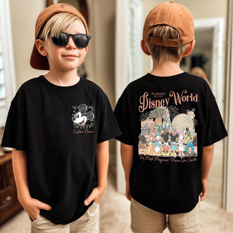 May include: Black t-shirt featuring Mickey Mouse with the text "Custom Name" on the front. The back of the shirt displays "Florida Disney World" with a colorful graphic of Disney characters and the phrase "The Most Magical Place On Earth."