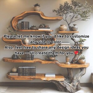 May include: A custom-made wooden shelf unit with a unique tree-like design. The shelves are made of natural wood and hold books, plants, and decorative vases. The text on the image says, "Please let me know if you'd like to customize any size or color."