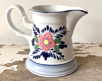 Ceramic Pitcher with flower design unmarked