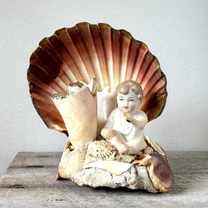 Shell Art Piece with Bisque Baby Figure