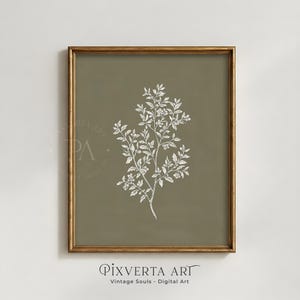 May include: A framed botanical print with a white floral branch design on an olive green background. The artwork is in a gold-coloured frame. The text "Pixverta Art" and "Vintage Souls - Digital Art" are at the bottom.