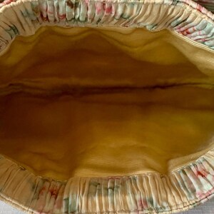 Interior view of Loeffler Randall Rayne clutch with satin-style lining.