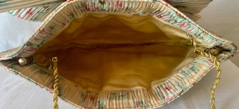 Interior view of Loeffler Randall Rayne clutch with satin-style lining.