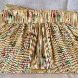 Back view of Loeffler Randall Rayne Tan Vine Floral clutch showing pleated fabric and gold logo plaque.