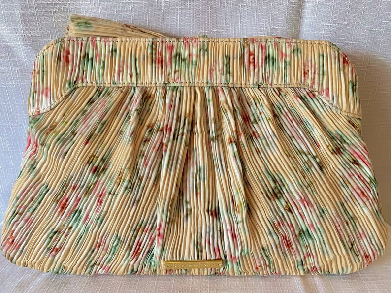 Back view of Loeffler Randall Rayne Tan Vine Floral clutch showing pleated fabric and gold logo plaque.