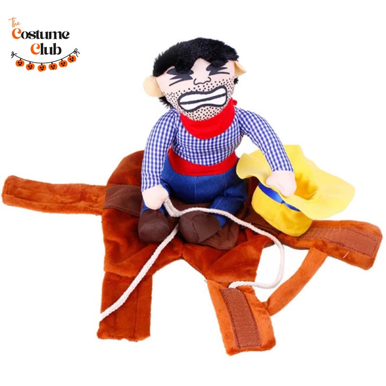 May include: A plush dog costume featuring a cowboy riding a horse. The cowboy has a black mustache and is wearing a red bandana, blue jeans, and a plaid shirt. The horse is brown with a yellow hat attached. The Costume Club logo is in the top left.