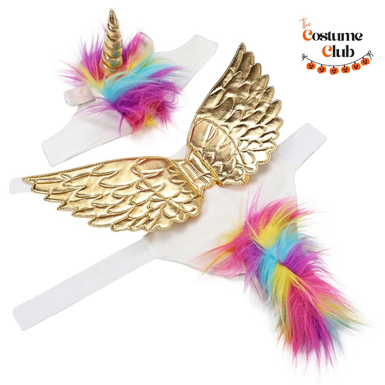 May include: A white unicorn costume set with a gold horn, gold wings, and a rainbow-colored tail. The set includes a headband, wings, and a tail, perfect for Halloween or dress-up. The Costume Club logo is in the upper right corner.