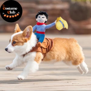 May include: A corgi dog wearing a brown saddle costume with a cowboy doll rider. The cowboy doll is wearing a blue plaid shirt, blue jeans, and a yellow hat. The dog is running on a wooden surface. The Costume Club logo is in the top left corner.
