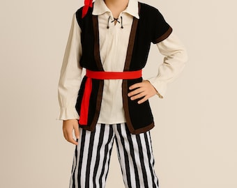 May include: A child's pirate costume featuring a black tricorn hat with a skull and crossbones, an eye patch, and a red sash. The outfit includes a white shirt, black vest, and black and white striped pants. The Costume Club logo is in the upper left.