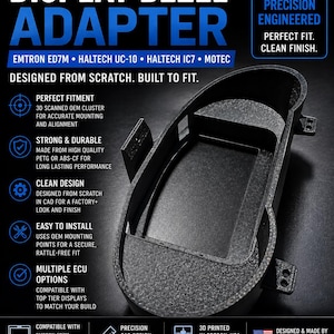 May include: A black 3D printed display bezel adapter for Subaru WRX STI GD 2002-2007 models. The adapter features a textured finish, mounting tabs, and a central rectangular opening designed to house Emtron ED7M, Haltech UC-10, Haltech IC7, or Motec displays.
