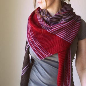 May include: A set of three ceramic mugs with a speckled, matte finish. The mugs are in shades of cream, light grey, and dark grey. Each mug has a simple, minimalist design, ideal for coffee or tea. The mugs are stacked on top of each other.