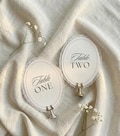 Personalized Lace Trim Table Numbers, Romantic Wedding Decor, Ivory Oval Signs product logo