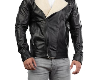 May include: Black leather jacket with a cream-colored shearling collar and lining. The jacket features a zipper closure, multiple pockets, and a classic biker style. The jacket is worn with gray jeans.