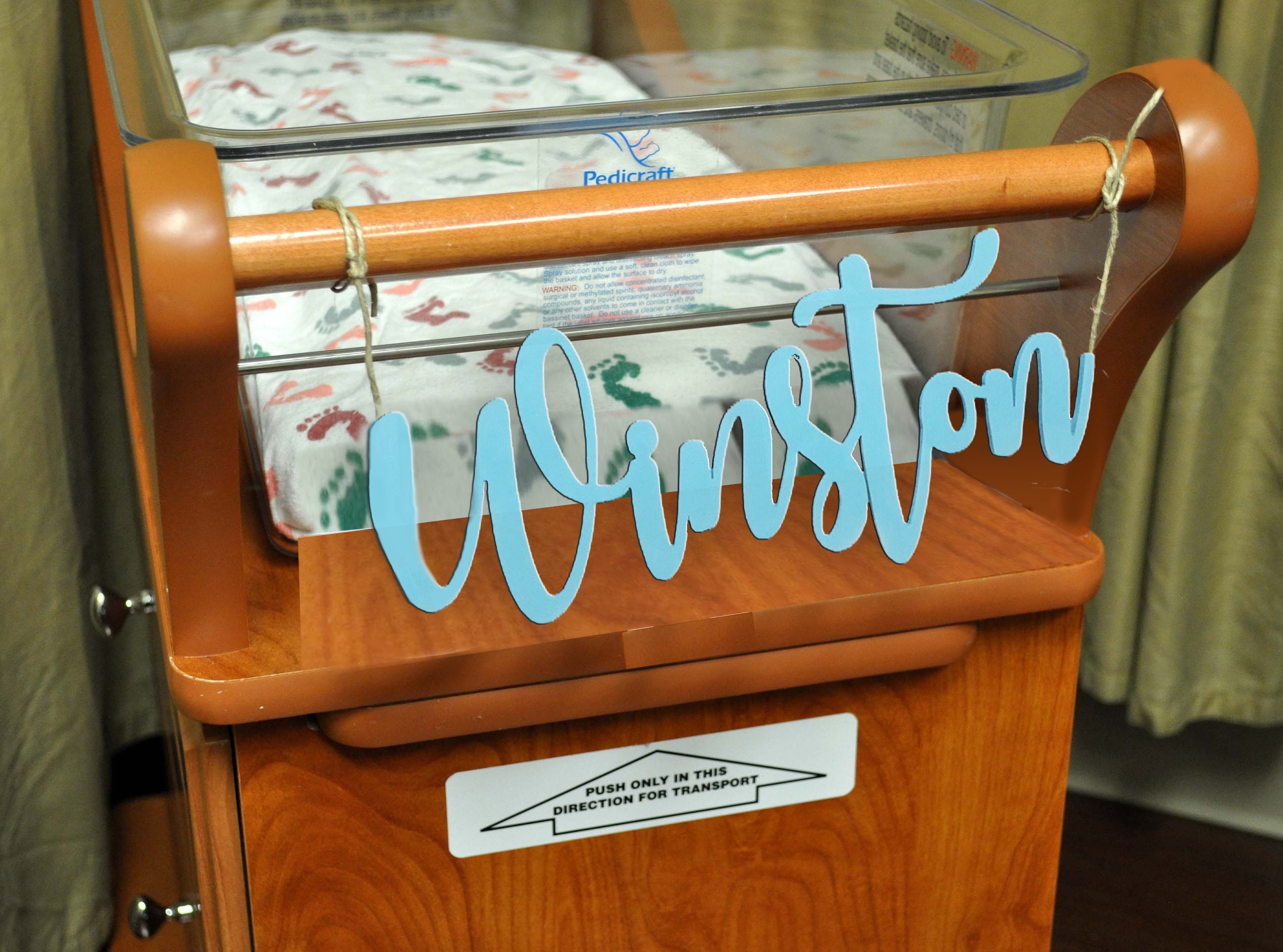 wooden hospital bassinet