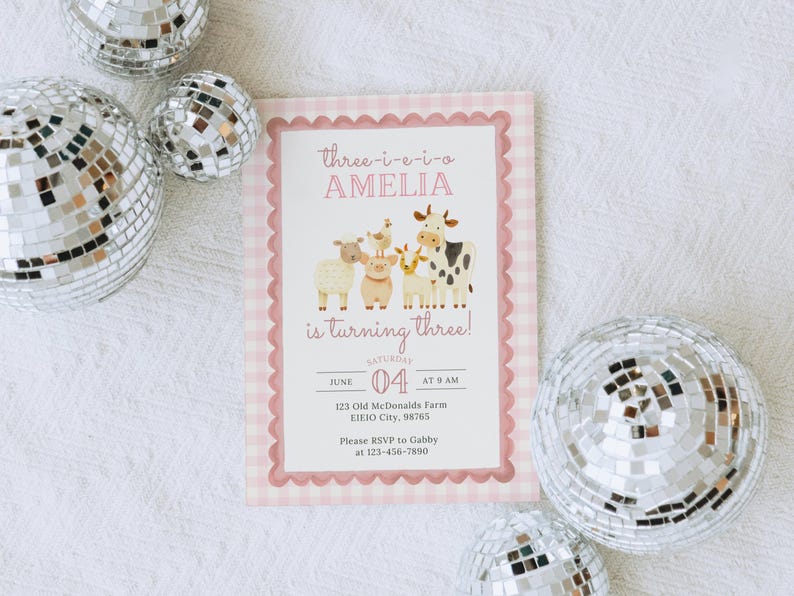 May include: A pink and white gingham-bordered invitation with the text "Three-i-e-i-o AMELIA is turning three!" and farm animal illustrations. The invitation is surrounded by silver disco balls.