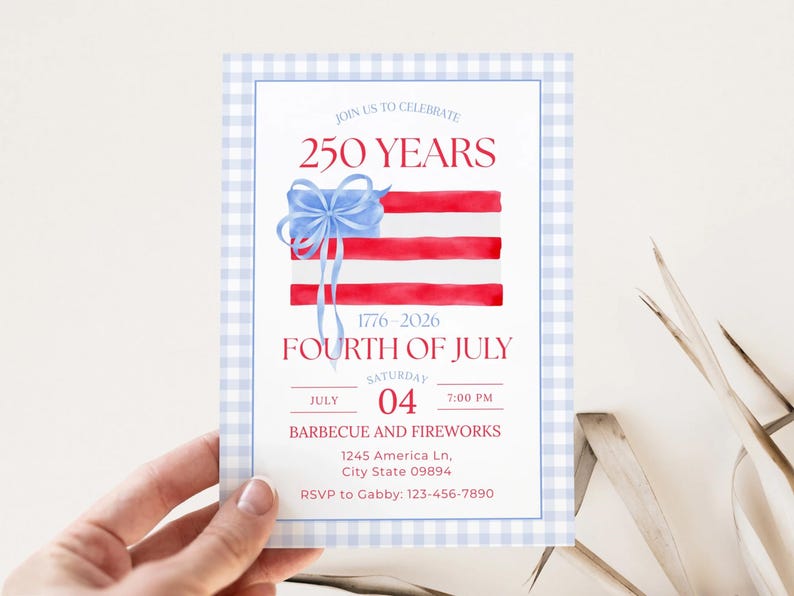 An invitation card for a 250th-anniversary Fourth of July celebration (1776–2026). The design features a light blue and white gingham border. In the center, a watercolor illustration shows red stripes topped with a blue watercolor bow, mimicking the American flag. The text reads "250 YEARS" in red serif font, followed by "FOURTH OF JULY" and event details for a barbecue and fireworks.