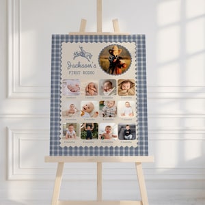 May include: A rectangular milestone photo board with a blue and white plaid border. It features the text Jackson's FIRST RODEO, a graphic of a bucking horse, and twelve individual photographs documenting a child's growth from newborn to eleven months.