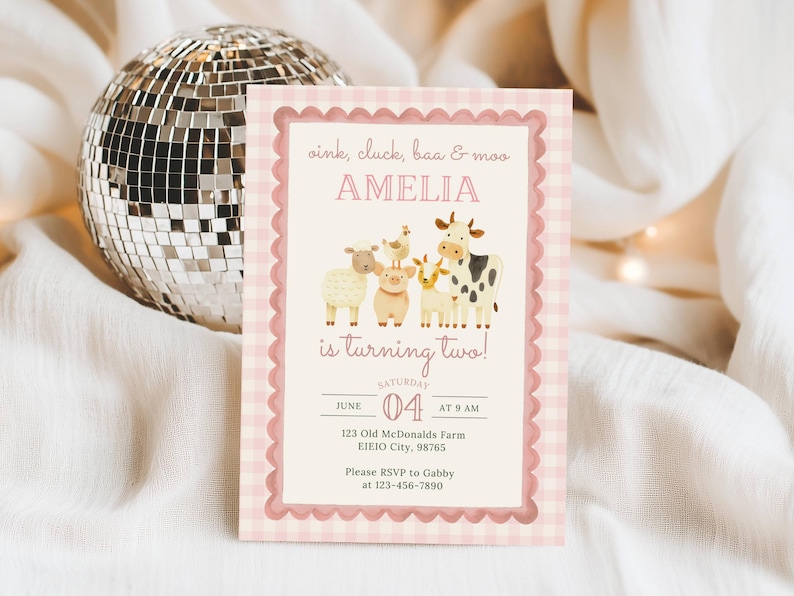 May include: A pink and white gingham patterned invitation with the text "oink, cluck, baa & moo" and "AMELIA is turning two!" features illustrations of farm animals. The invitation includes event details.