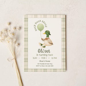 May include: A birthday invitation featuring a watercolor illustration of a duck holding a green balloon. The invitation has a plaid border and includes the text "Duck Duck Deuce" and "Oliver is turning two". The date and time are also included.