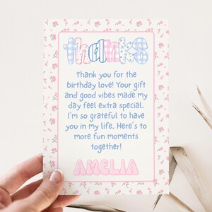 May include: A thank you card with a floral border and the word "thanks" in a playful font. The card includes a message expressing gratitude for birthday wishes and gifts, and is personalized with the name "Amelia".