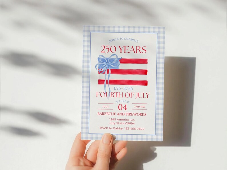 May include: A Fourth of July invitation with a watercolor design. The invitation features a red, white, and blue flag illustration with a blue bow. Text includes "250 Years", "Fourth of July", and event details.