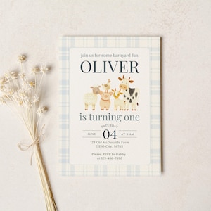 May include: A birthday invitation with a blue and white check pattern. The invitation reads "OLIVER is turning one" and features farm animal illustrations. A bunch of dried flowers is on the left.