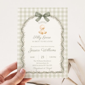 May include: A baby shower invitation with a light green gingham pattern background. The invitation features a gray bow, a duck illustration, and the text "Silly Goose is About to be Loose." Details include the date, time, and location.