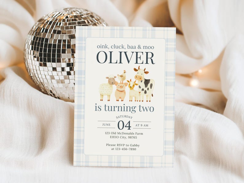 May include: A light blue and white plaid invitation with the text "oink, cluck, baa & moo OLIVER is turning two". The invitation features illustrations of farm animals. A disco ball is in the background.