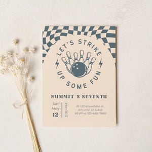 May include: A beige invitation card with a bowling theme. The card features the text "LET'S STRIKE UP SOME FUN" and "SUMMIT'S SEVENTH". Additional details include the date, time, and RSVP information. A sprig of dried flowers is on the left.