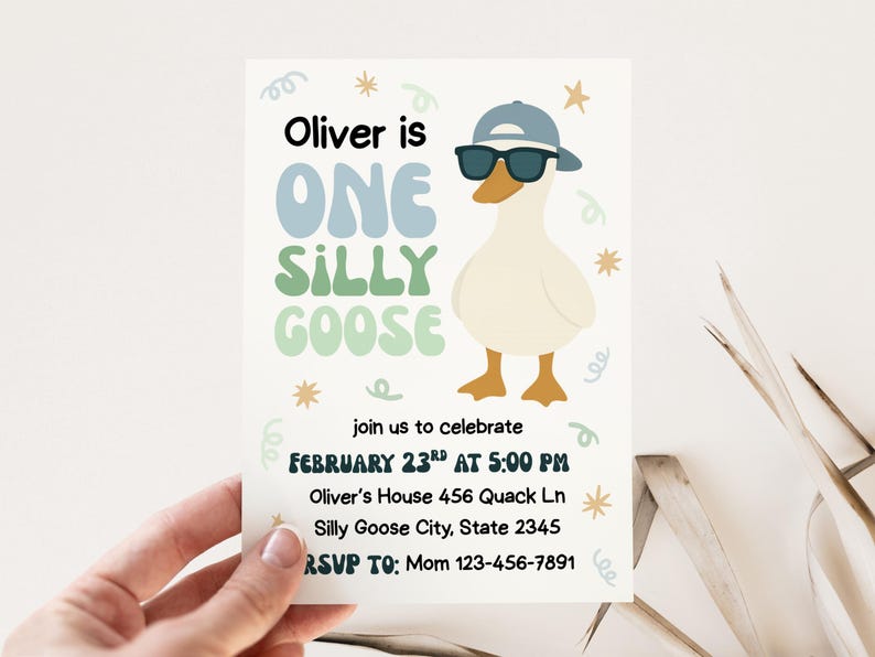 May include: A birthday invitation featuring a cartoon goose wearing sunglasses and a cap. The text reads "Oliver is ONE SILLY GOOSE" with event details. The invitation is held by a hand.