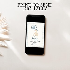 One silly goose boy first birthday invitation on smartphone screen, blue plaid border and cute goose with backwards hat and balloon, digital invite sized for texting parents or sharing on social media, modern editable Canva template, printable or digital download for baby boy 1st birthday party.
