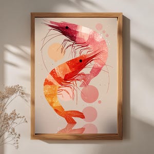 May include: A framed art print depicting two stylised prawns in shades of red, orange, and pink. The prawns are arranged in a curved composition against a neutral background, with pink circles and a reflection effect.