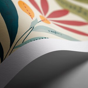 May include: Close-up of a floral pattern with a cream background. The design features large leaves in teal and green, with red and orange flower shapes. The paper is slightly curled, revealing a white edge and a grey shadow.
