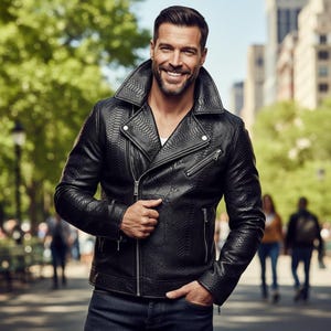 May include: Black leather jacket with a snakeskin texture, wide collar, and asymmetrical zip. The jacket has multiple pockets and is worn over a white shirt with dark denim jeans. The jacket's design is stylish.