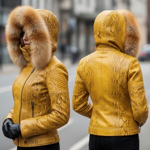 May include: A yellow snakeskin-effect jacket with a fur-trimmed hood. The jacket features a zip closure and black gloves. The hood is lined with brown fur. The jacket is shown from the front and back.