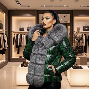 May include: A green snakeskin-patterned puffer jacket with a large gray fur collar and trim. The jacket has a high collar and a shiny finish. The background shows a clothing store with racks of clothing and accessories.