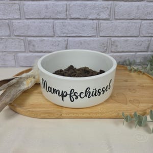 Keramiknapf in weiß für Futter oder Wasser
Design: Mampfschüssel oder Schlabbernapf
Geschenk Hundebesitzer, Hund Wassernapf, Napf für Hunde