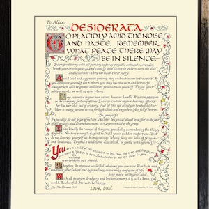 May include: Framed print of the poem "Desiderata" with ornate calligraphy in red, green, and yellow on an off-white background. The text is in black, with a black frame. The poem is dedicated "To Alice" and signed "Love, Dad."