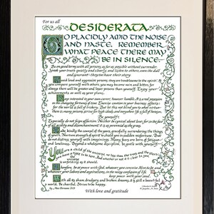 May include: Framed print of the poem "Desiderata" with ornate calligraphy in green and black ink. The text is centered on a cream-colored background, within a black wooden frame. The poem's title is at the top.