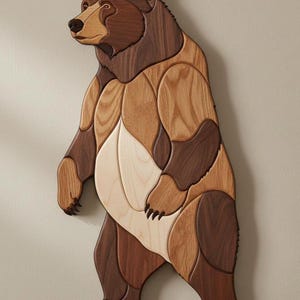 May include: A wall-mounted wooden bear sculpture crafted from multiple pieces of wood in varying shades of brown, ranging from light cream to dark walnut. The bear is depicted standing on its hind legs, showcasing distinct wood grain patterns.
