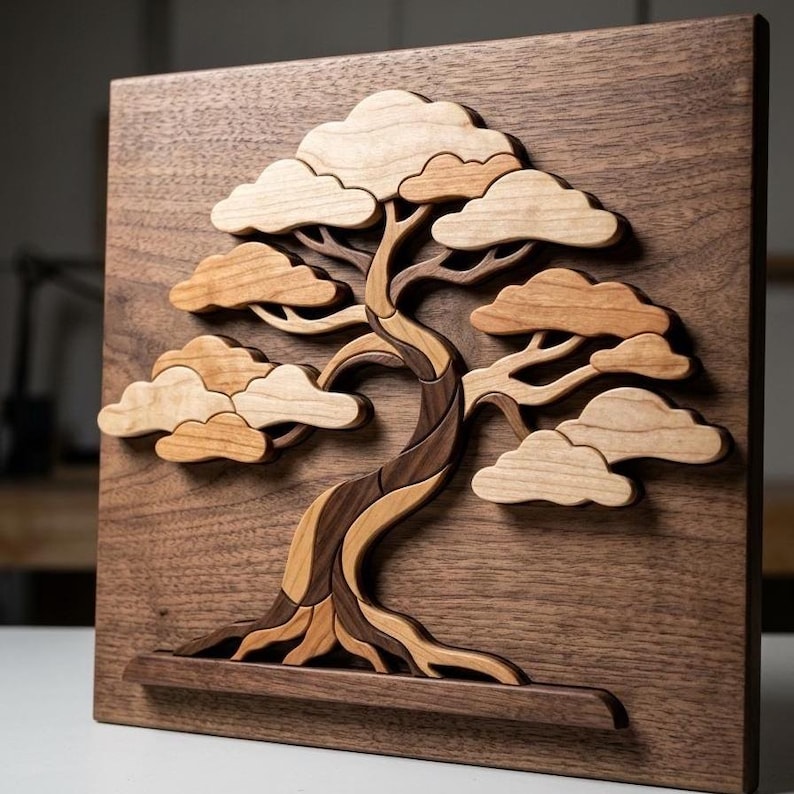 May include: A square wooden wall art piece featuring a three-dimensional layered bonsai tree design. The artwork is crafted from various shades of natural wood, showcasing a dark brown base panel with a lighter wood tree trunk and foliage.