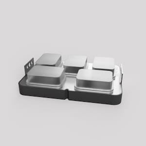 May include: A modular food container set with five individual compartments. Each compartment has a clear lid and a silver-coloured base. The set is arranged on a black tray with a silver interior.