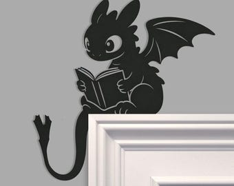 Toothless dragon holding a book Metal Door Topper