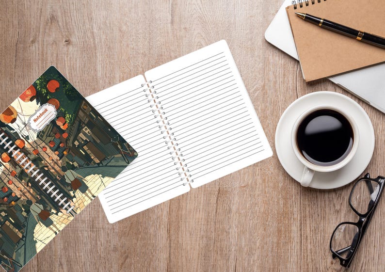 May include: An open spiral notebook with lined pages sits next to a closed notebook with an illustrated cover. A cup of coffee, glasses, a pen, and a laptop are on a wooden surface.