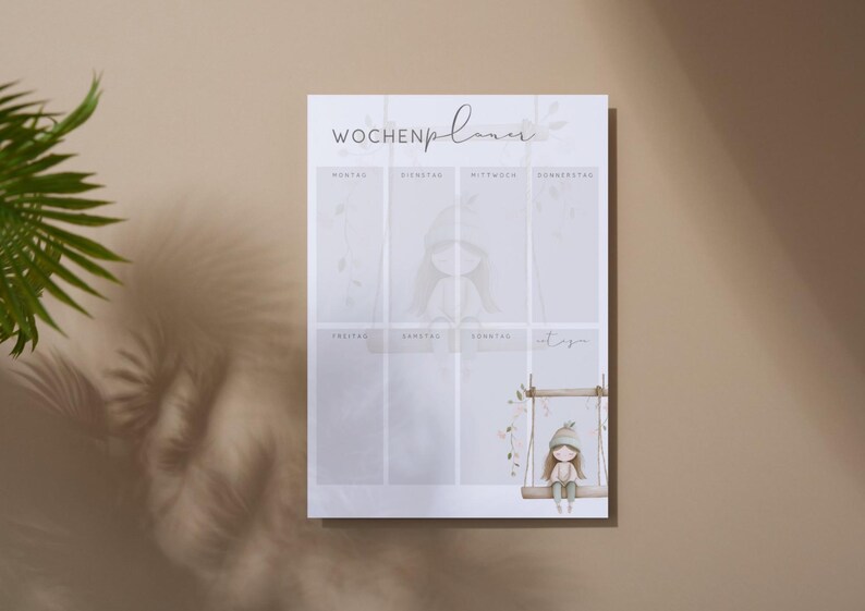 May include: A weekly planner with the German text "Wochenplaner" at the top. The planner features a watercolor illustration of a girl on a swing. The design includes soft colors and floral accents, creating a gentle and inviting aesthetic.