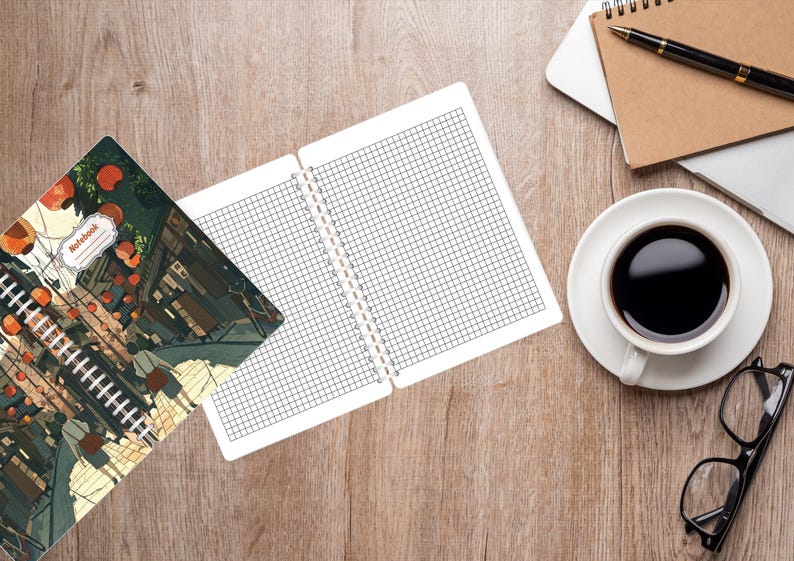 May include: An open notebook with grid paper sits next to a closed notebook with a colorful illustration. A cup of coffee, glasses, a pen, and a laptop are on a wooden surface. The closed notebook has the word "Notebook" on it.