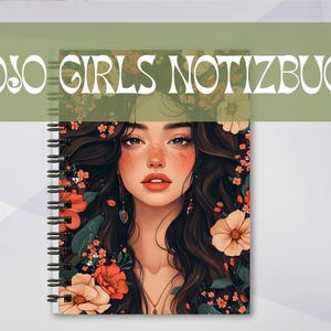 May include: Spiral-bound notebook with the text "BOJO GIRLS NOTIZBUCH" at the top. The cover features a portrait of a woman with long, dark hair adorned with flowers. The woman has red lips and freckles. The notebook has a white background.