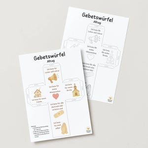 May include: Two white paper sheets with German text and illustrations. The sheets are titled "Gebetswürfel Alltag" and feature images of a megaphone, house, heart, church, bandage, and praying hands. The text is in German.